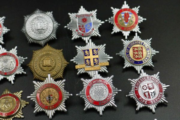 05 - 146.7_Collection of Fire brigade helmet badges_98384