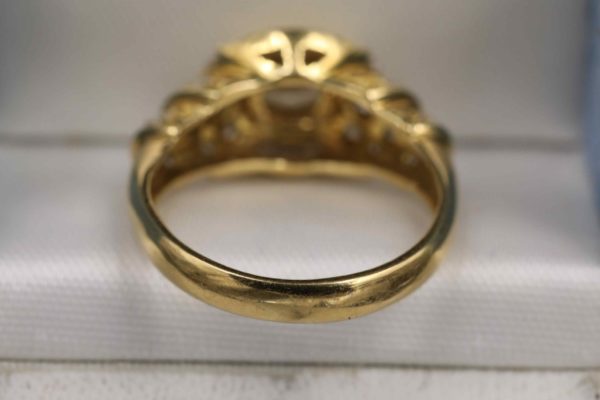 05 - 273.8_A late 20th Century oval diamond cluster ring_98772