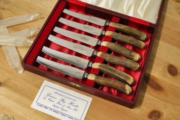 05 - 33.5_Two sets of stag handled steak knives and forks_97589